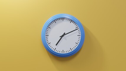 Glossy blue clock on a orange wall at eleven past seven. Time is 07:11 or 19:11
