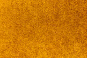 Orange suede fabric background. Abstract texture wallpaper