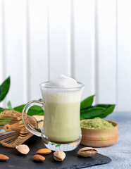 Matcha cappuccino with almond milk cup close-up