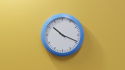 Glossy blue clock on a orange wall at nineteen past ten. Time is 10:19 or 22:19