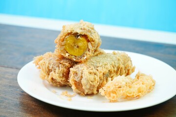 Thai Fried banana fritters with coconut and sesame, Thai desserts  (Kluay Khaek, Kluay Tod)