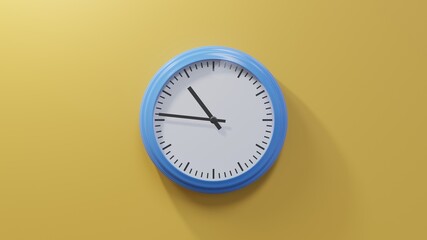 Glossy blue clock on a orange wall at forty-six past ten. Time is 10:46 or 22:46