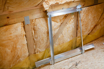 New metallic skylight window frame near wall