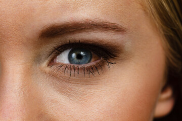 Fototapeta na wymiar Close up female eye with red spot