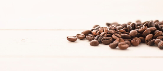 roasted coffee beans on a wooden white table