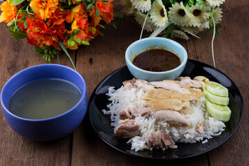 Thai food gourmet steamed chicken with rice , khao mun kai in wood background