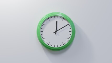 Glossy green clock on a white wall at ten past twelve. Time is 00:10 or 12:10