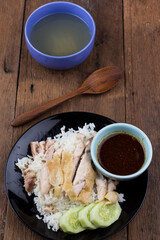 Thai food gourmet steamed chicken with rice , khao mun kai in wood background