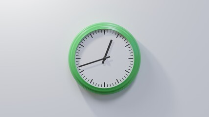 Glossy green clock on a white wall at forty-two past twelve. Time is 00:42 or 12:42