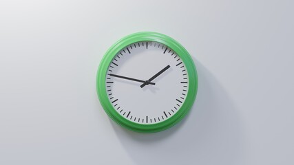Glossy green clock on a white wall at forty-seven past one. Time is 01:47 or 13:47