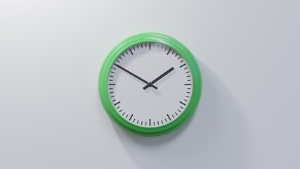 Glossy green clock on a white wall at ten to two. Time is 01:50 or 13:50