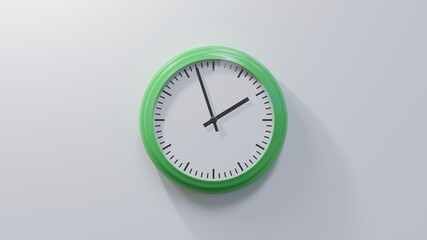 Glossy green clock on a white wall at fifty-seven past one. Time is 01:57 or 13:57