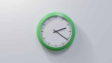 Glossy green clock on a white wall at twenty-one past two. Time is 02:21 or 14:21