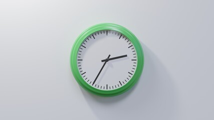 Glossy green clock on a white wall at thirty-five past two. Time is 02:35 or 14:35