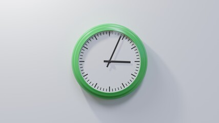 Glossy green clock on a white wall at four past three. Time is 03:04 or 15:04