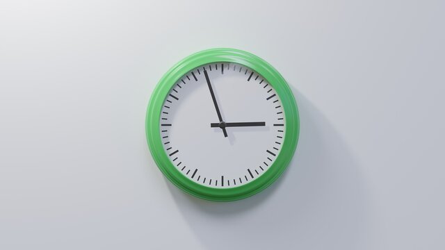 Glossy green clock on a white wall at fifty-seven past two. Time is 02:57 or 14:57