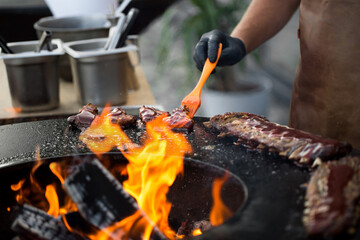 Chicken wings on barbecue grill street food outdoors festival