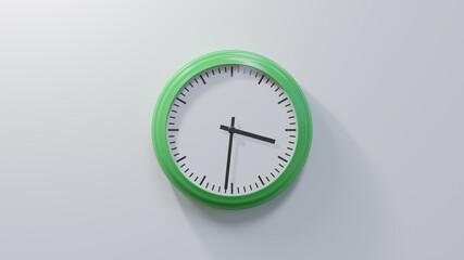 Glossy green clock on a white wall at thirty-one past three. Time is 03:31 or 15:31