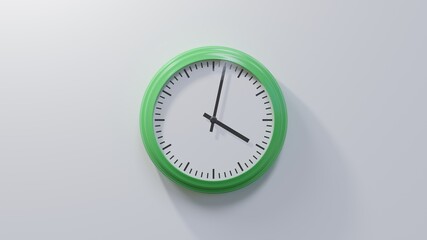 Glossy green clock on a white wall at two past four. Time is 04:02 or 16:02