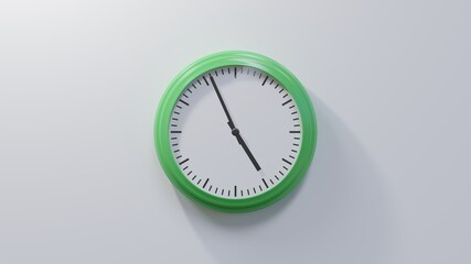 Glossy green clock on a white wall at fifty-six past four. Time is 04:56 or 16:56