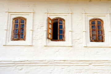 Fototapeta na wymiar three old windows in russia