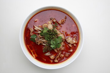 Close up of  Chinese Sichuan province style Cuisine Spring water frog fried in spicy pepper hot soup 