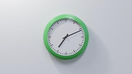 Glossy green clock on a white wall at eleven past seven. Time is 07:11 or 19:11