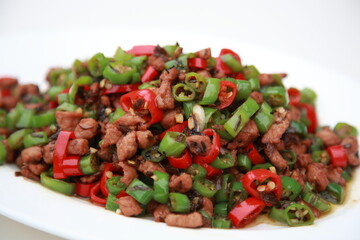 Close up of a typical Chinese Sichuan province cuisine Fried pork with chili and preserved vegetable 