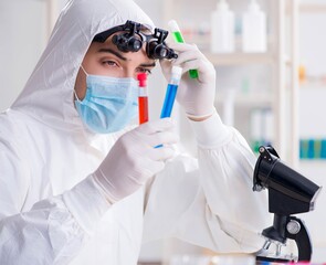 Young chemical scientist working in lab