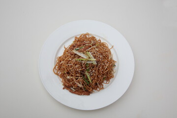 Close up of  Chinese Hong Kong and Cantonese style cuisine Soy sauce fried noodle with bean sprouts and shredded pork