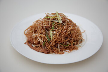 Close up of  Chinese Hong Kong and Cantonese style cuisine Soy sauce fried noodle with bean sprouts and shredded pork