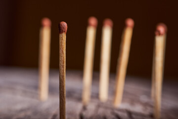 wooden matches are on the wooden frame. Concept photo.