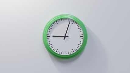 Glossy green clock on a white wall at three past nine. Time is 09:03 or 21:03
