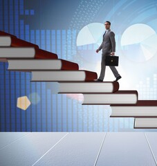 Businessman student climbing the ladder of education books