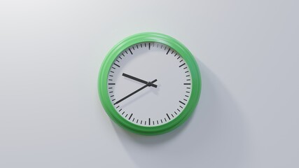 Glossy green clock on a white wall at twenty to ten. Time is 09:40 or 21:40