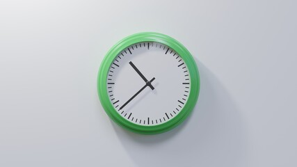 Glossy green clock on a white wall at thirty-eight past ten. Time is 10:38 or 22:38