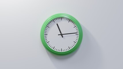 Glossy green clock on a white wall at fourteen past eleven. Time is 11:14 or 23:14