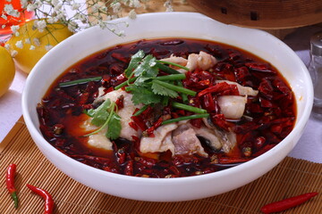 Close up of  a popular Chinese Sichuan province cuisine Boiled sliced fish in hot spicy Chili oil