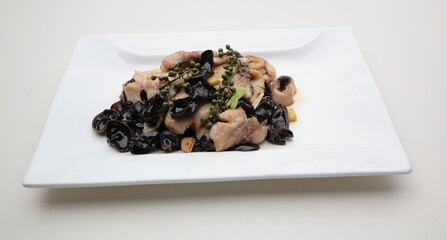 Close up of  a typical Chinese Sichuan province cuisine Fried sliced fish and black fungus with pepper