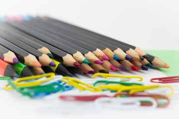 colored pencils on a white background