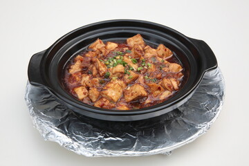 Close up of a typical Cantonese and Hong Kong cuisine Braised diced chicken, salted fish, and Tofu Clay Pot