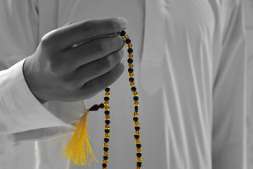close up of a muslim,  recited a tasbih 