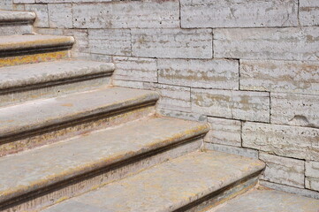 Concrete stairs leading up with concrete wall out of building