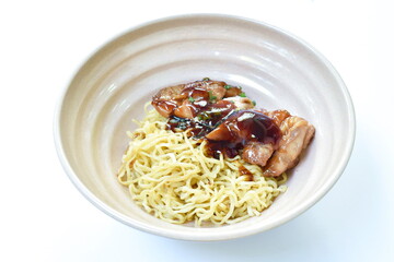 Chinese egg noodles roasted chicken dressing Teriyaki Japanese sauce on bowl 