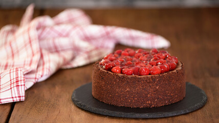 Delicious Homemade Chocolate Cheesecake Decorated With Cherry Sauce.