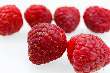 raspberries on white background