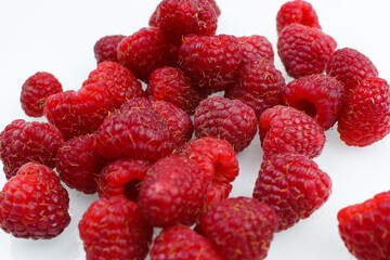 raspberries on white background