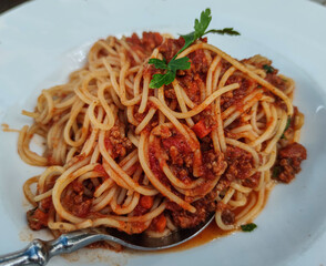Spaghetti Bolognese on a white plate - food photography