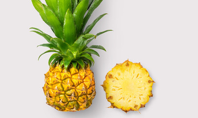 Pineapple and pineapple slice on a white background