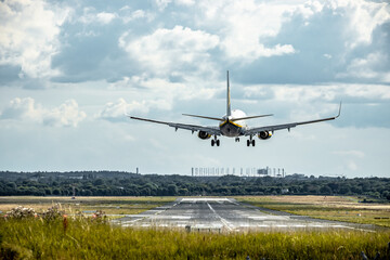 Fototapeta na wymiar airplane landing on the runway